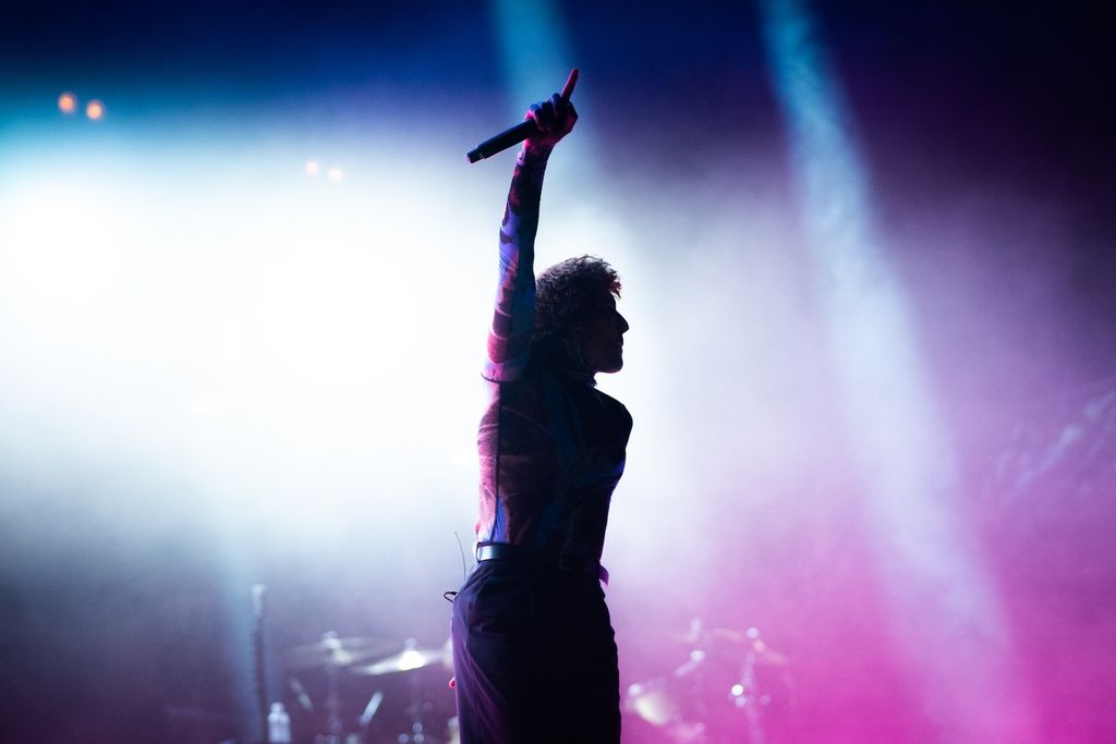 The singer Oli Sykes from the band Bring Me The Horizon performing on stage
