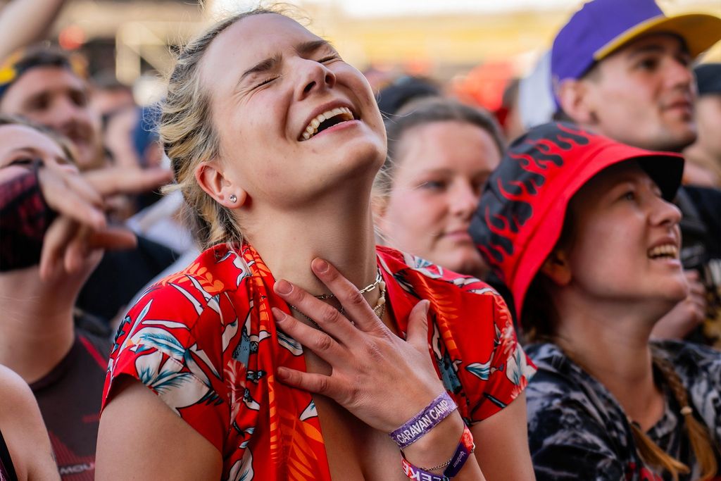 A concertgoer passionately sings along